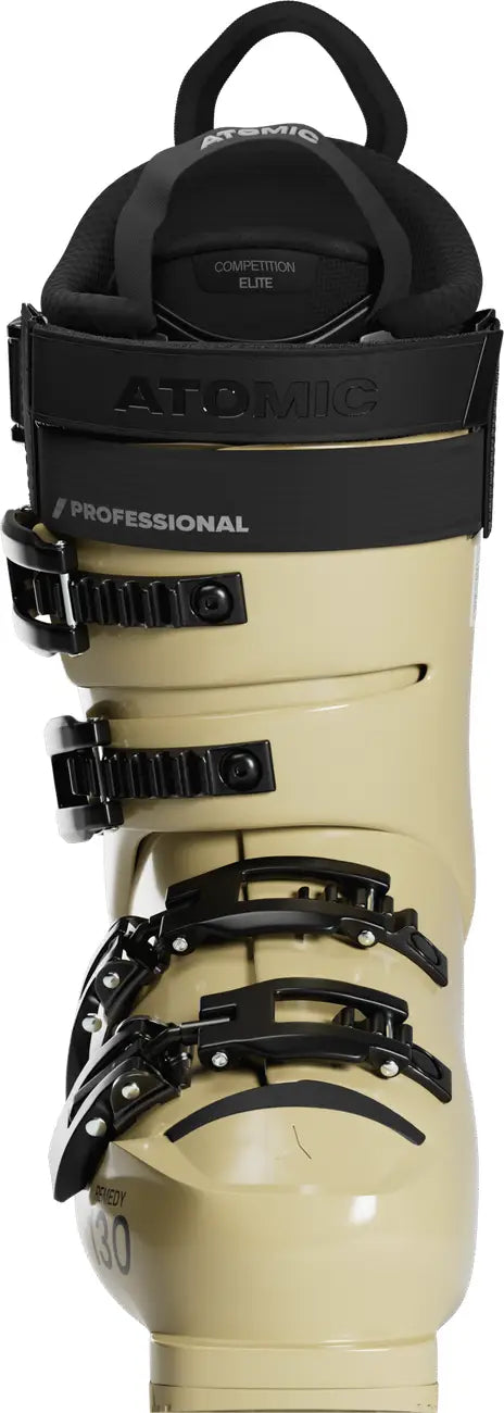 Beige ski boot with black straps and Atomic branding on a white background