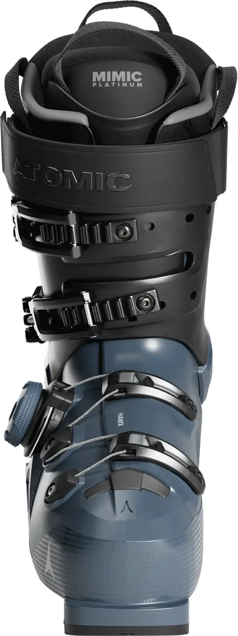 Blue ski boot with black straps and Atomic branding on a white background