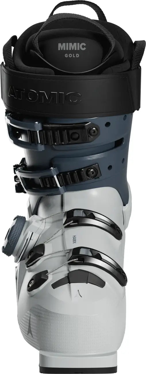 White and black ski boot with 'Mimic Gold' branding on a white background.