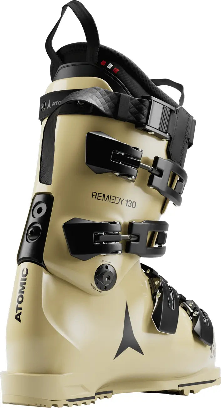 Butte colored Atomic ski boot with black straps and branding on a white background.