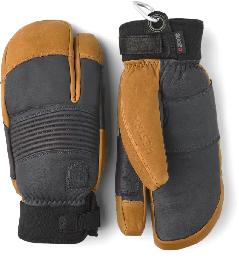 Pair of black and brown mittens with a visible brand logo on a white background