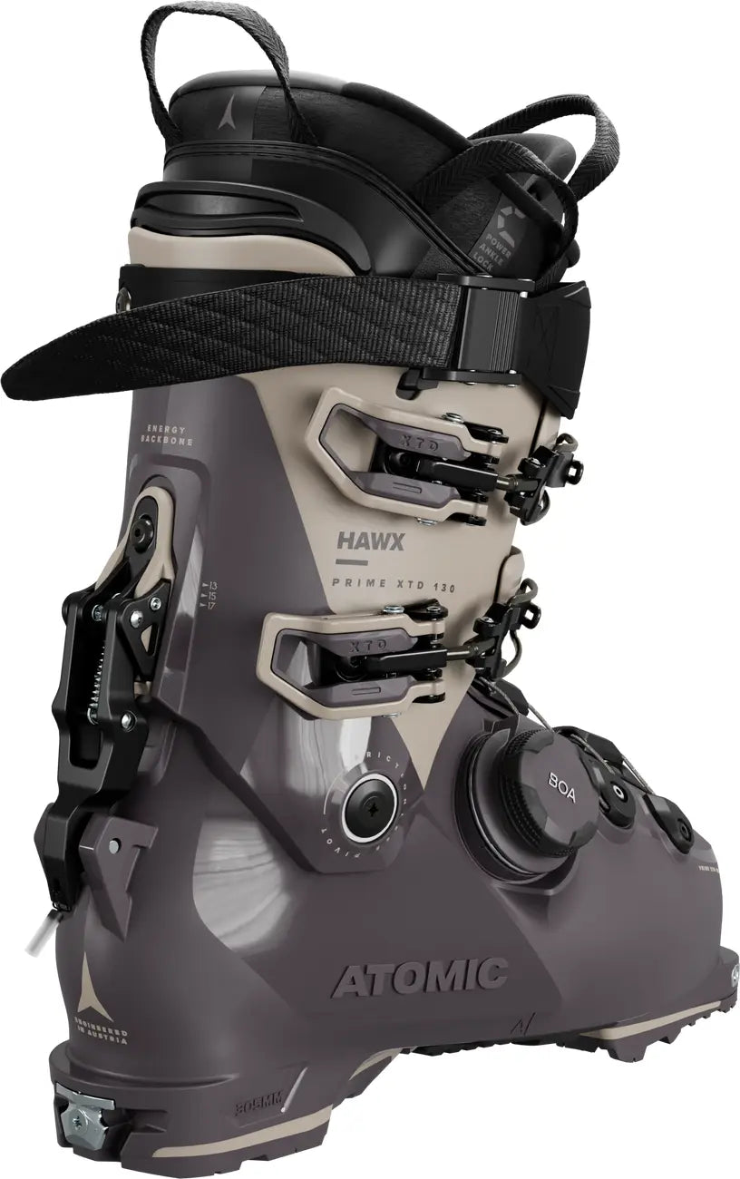 Gray and black Atomic ski boot on a white background with a close up iof the hike/ski mode.