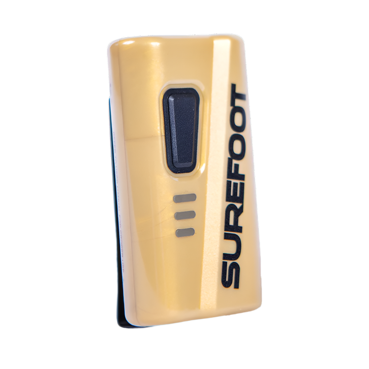 A gold ski boot heater with Surefoot written vertically in black. One button with three little light up bars.