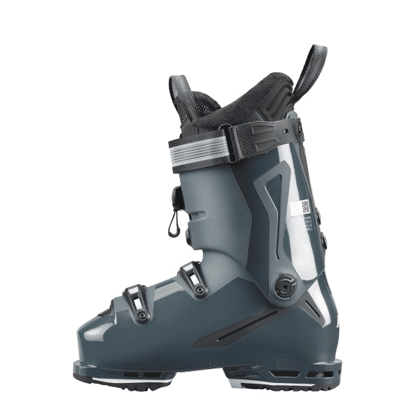 Greyish blue ski boot with a shiny texture on the bottom and back of the ski boot.