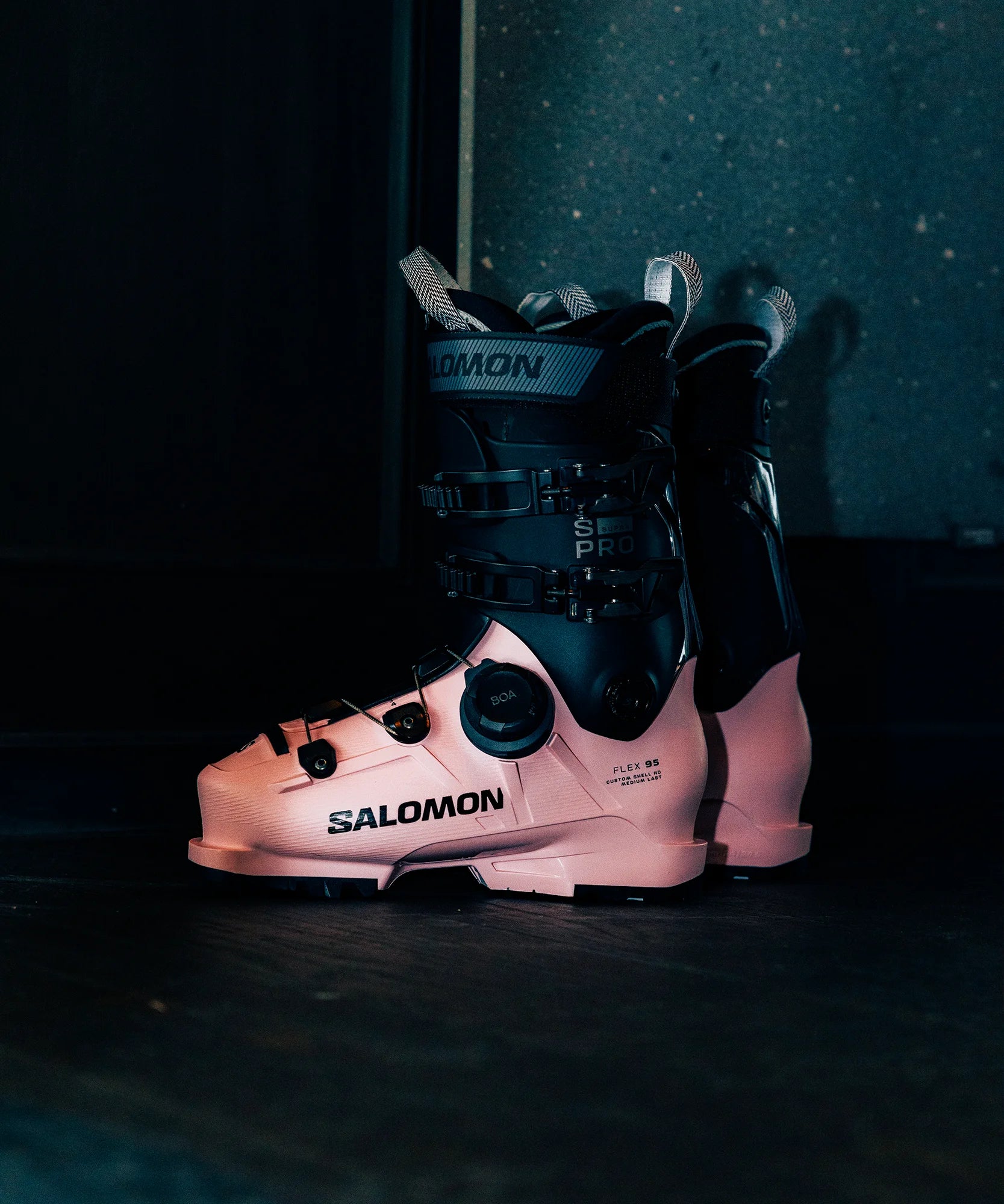 Salomon ski boots on a dark background