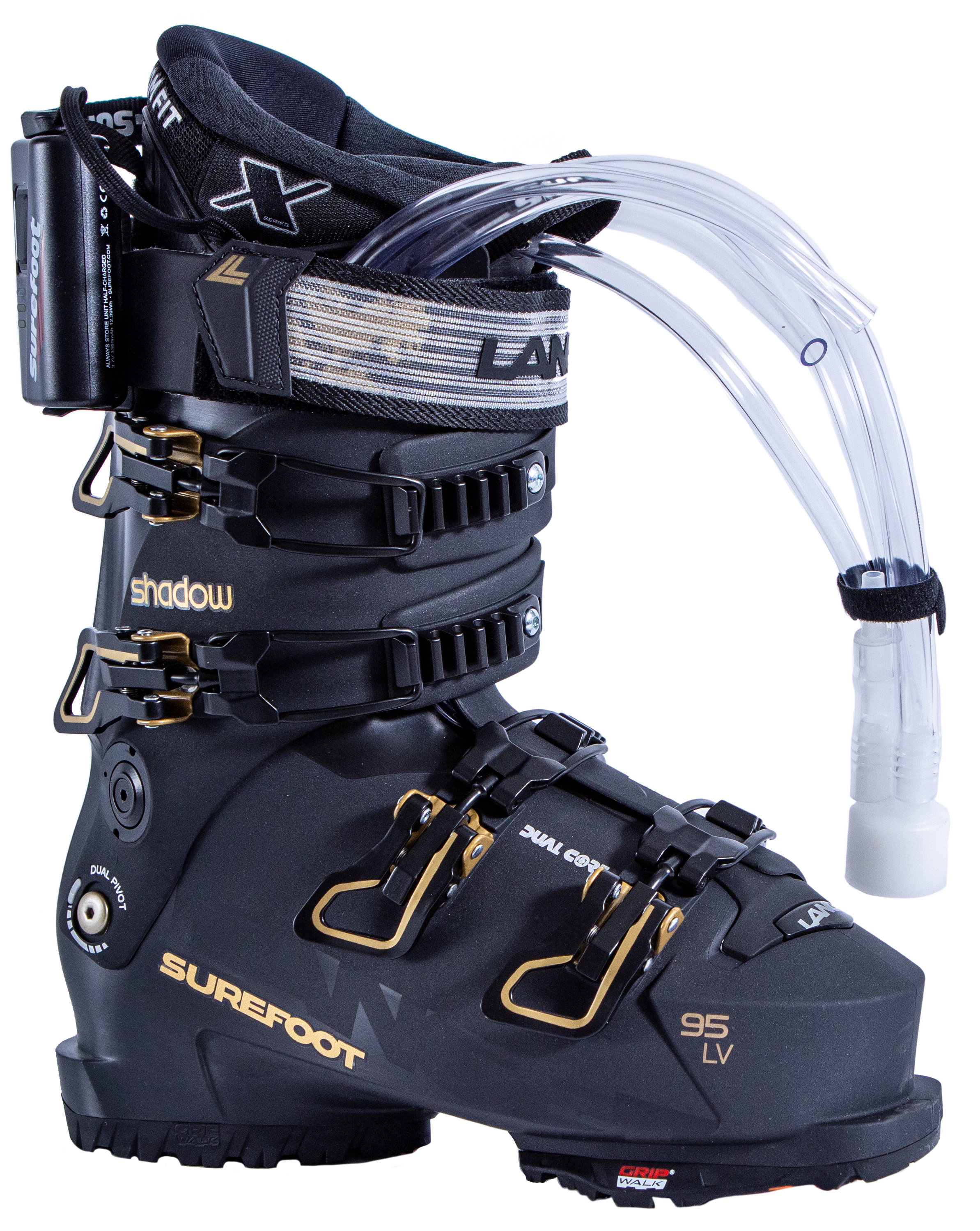 Surefoot Lange Shadow 95 LV matte black ski boot shell with gold accents on buckles and Lange logo in black on power strap, Surefoot logo in gold. Plastic tubes coming out for Surefoot memory foam injection into shell lining. Winterheat ski boot heater attached to outside edge.